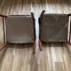 Two leather and Scandinavian teak chairs.
