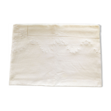 Old white tablecloth embroidered in linen