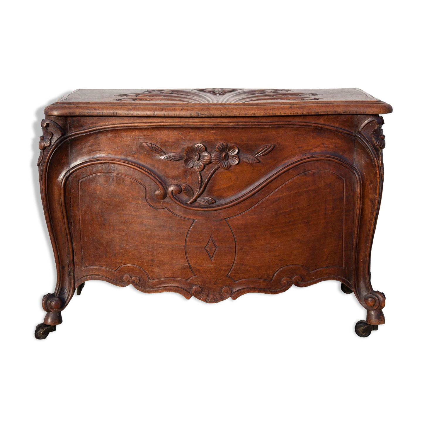 Old chest, carved wooden chest, curved chest on wheels, interior decoration