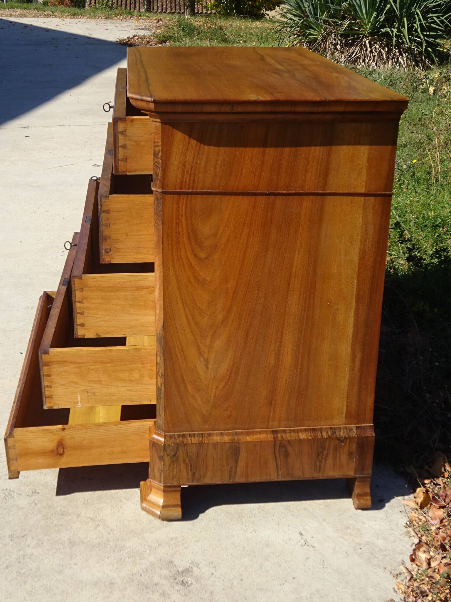Walnut and walnut burl commode in Louis Philippe style.