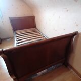 Bed with cherry wood base and bedside table