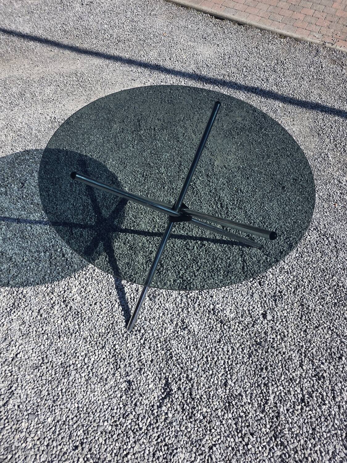 Round chrome metal table with smoked glass top from the 70s