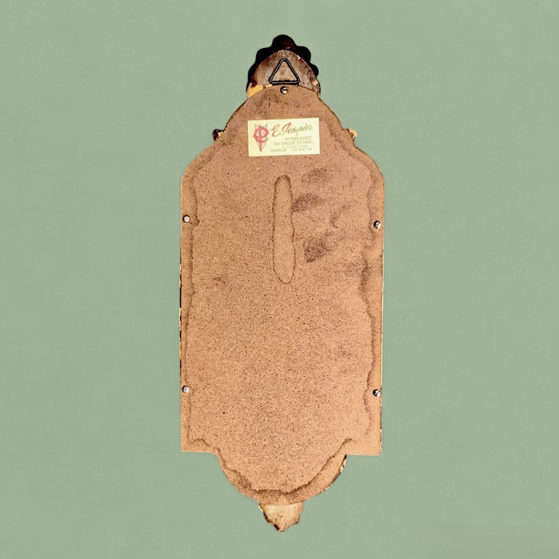 Old small wall mirror in golden resin