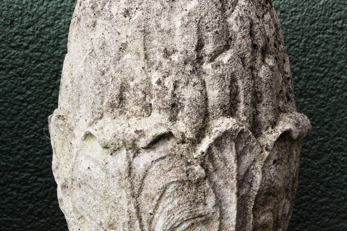 Pair of pine cones in reconstituted stone