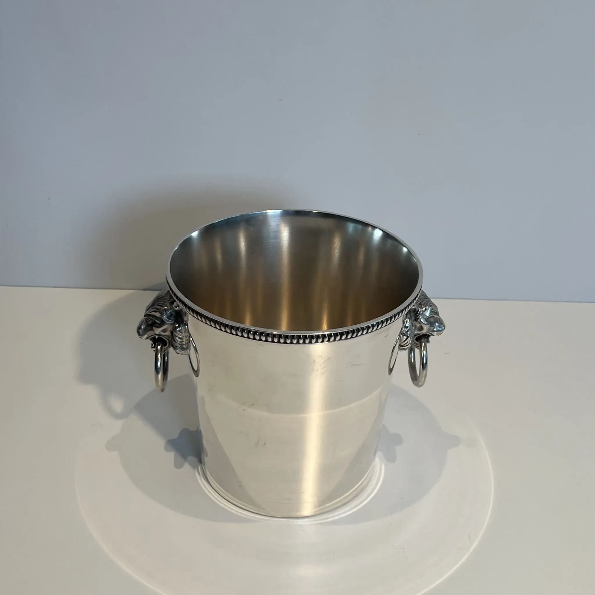 Silver-plated champagne bucket Orfèvrerie Saint-Médard. Handles in the shape of heads.