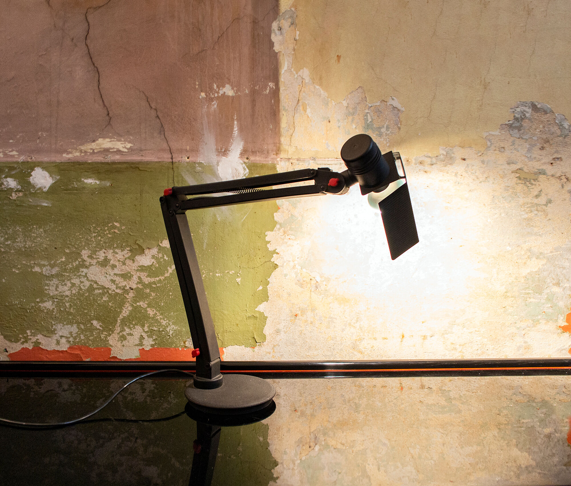 Desk lamp with metal frame and plastic details. Designer C.V.B. 80s