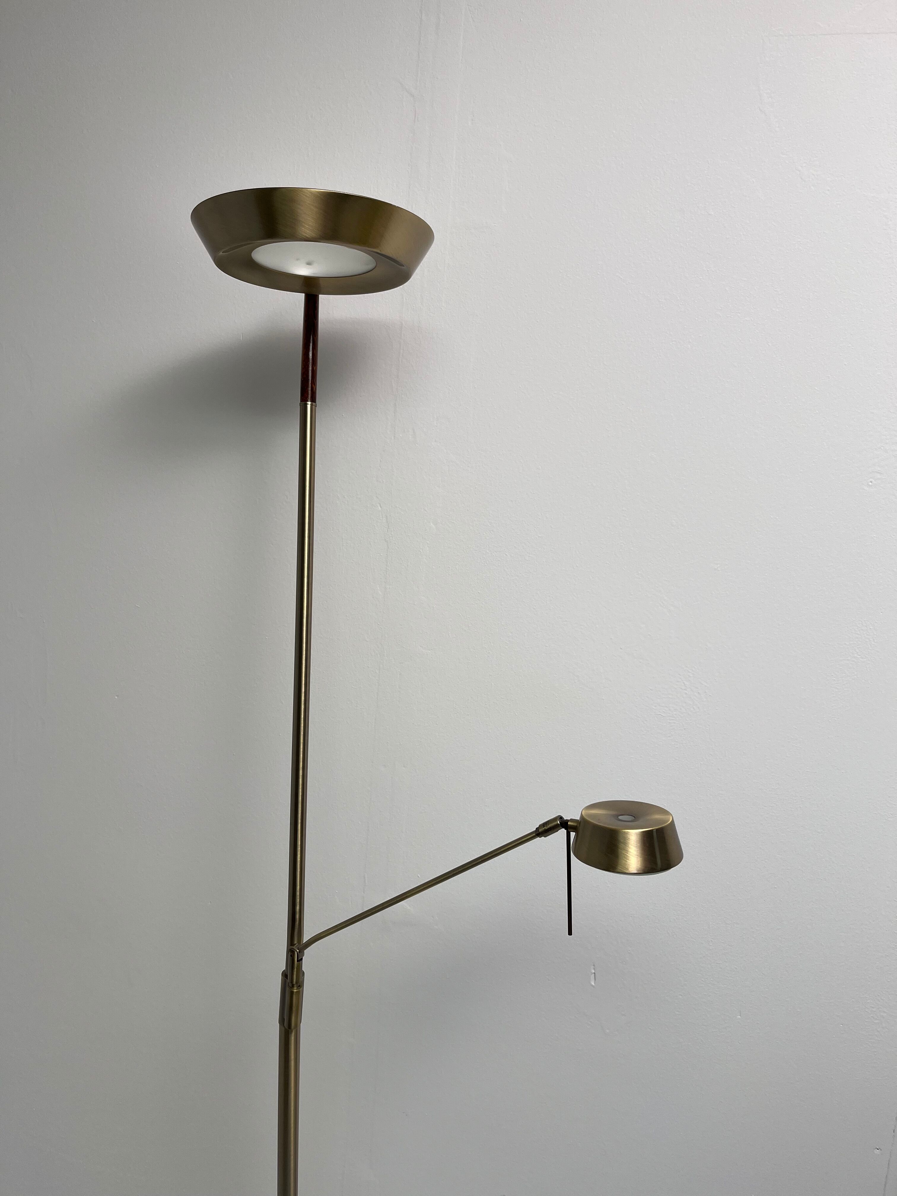 Golden metal floor lamp with reading light