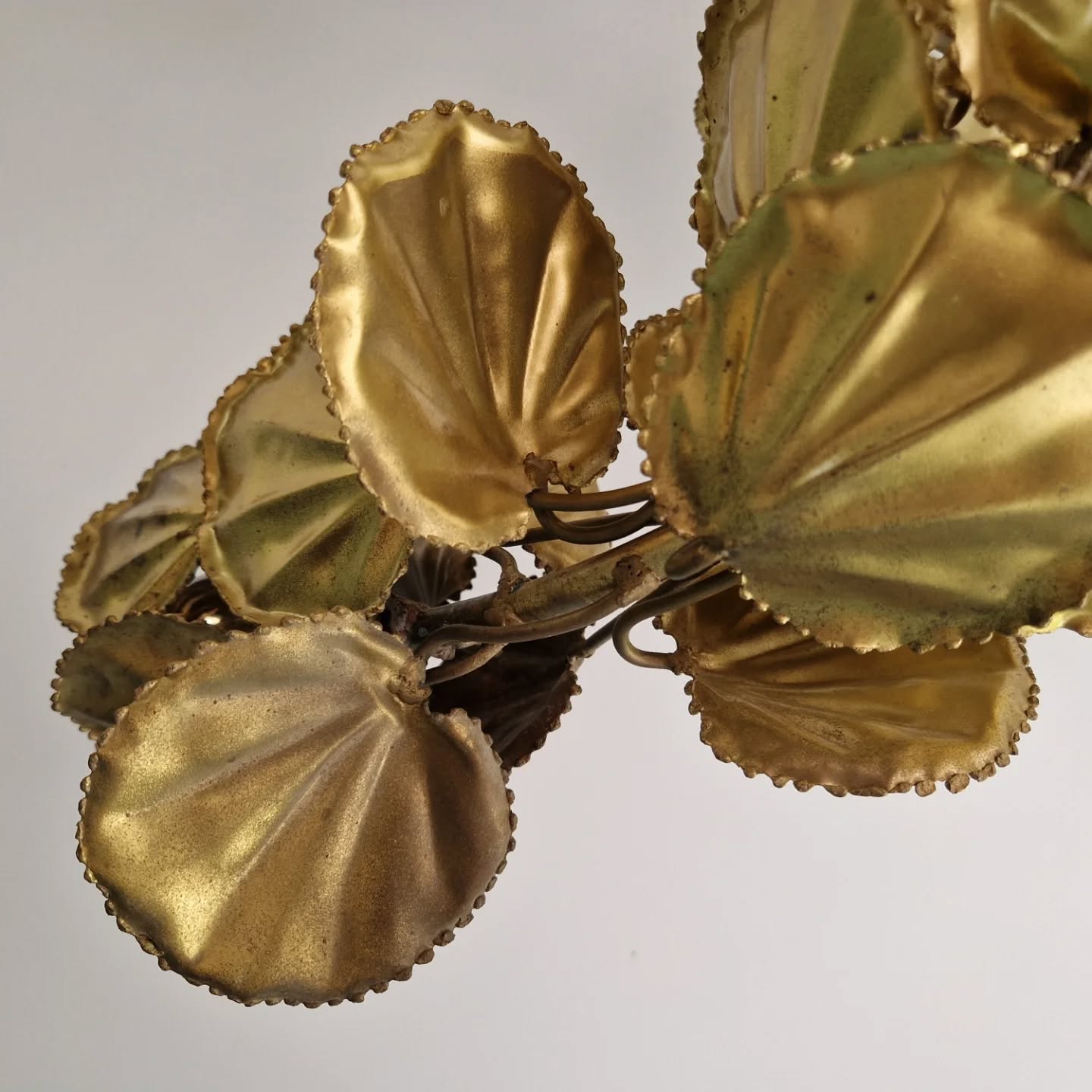 Large brutalist brass chandelier with floral decoration, 1970s.