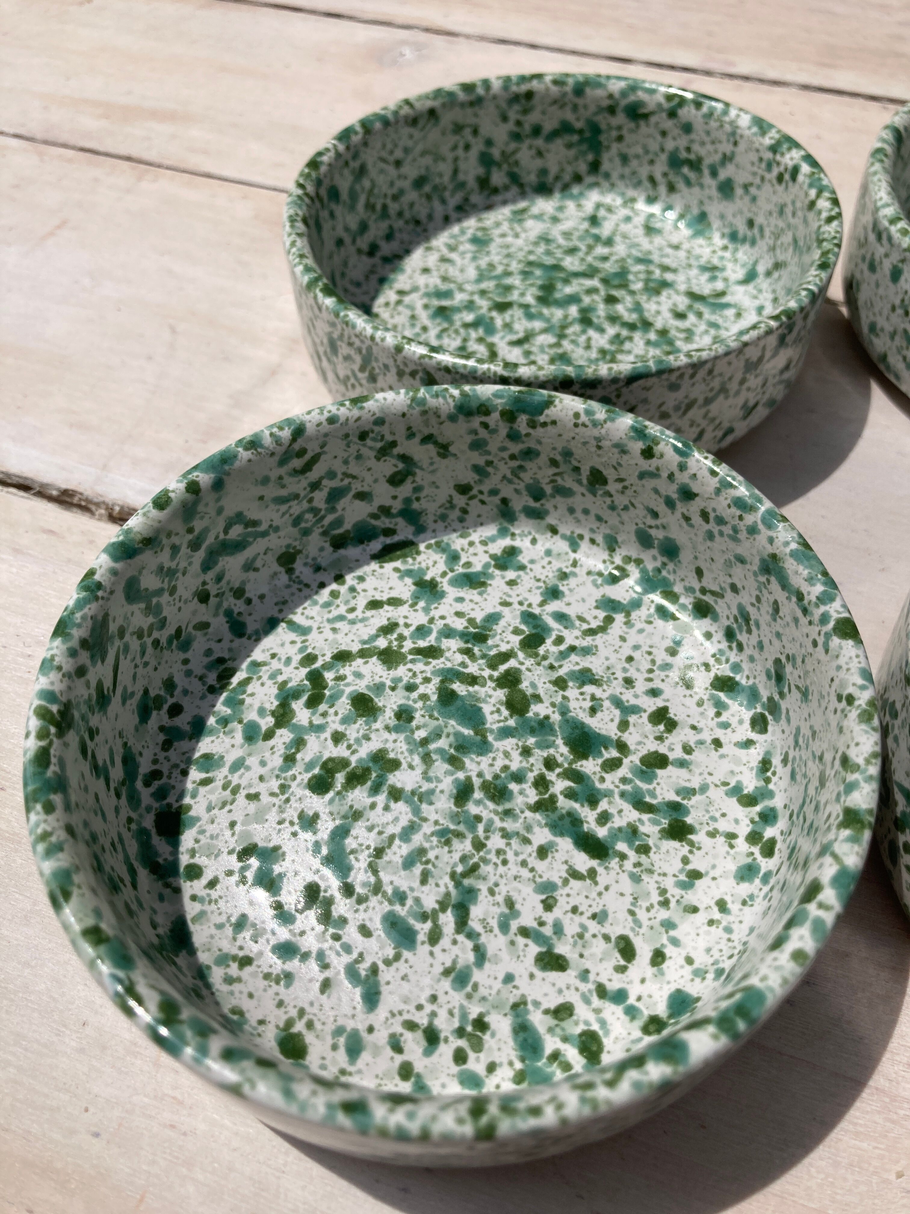 Four spotted green ramekins