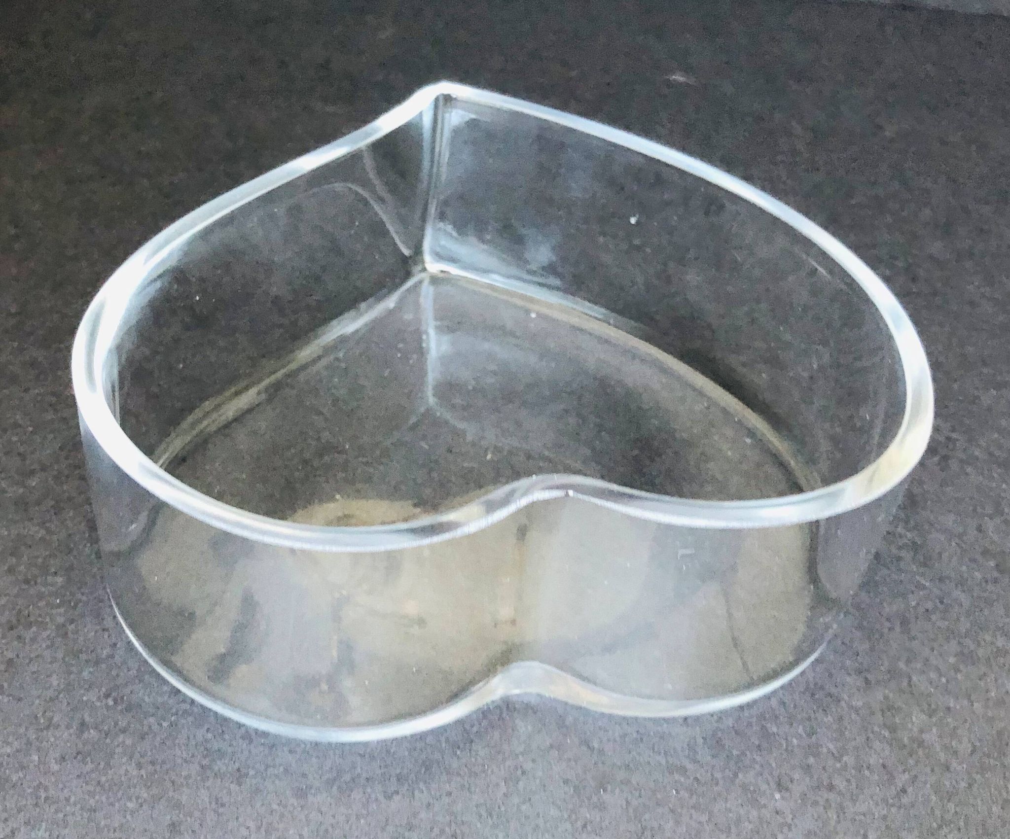 Empty glass heart-shaped pocket