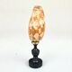 Snail shell conus on a turned black wooden base, late 19th century curiosities.