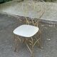 Vintage heart chair from the 1950s Hollywood Regency in gold metal.