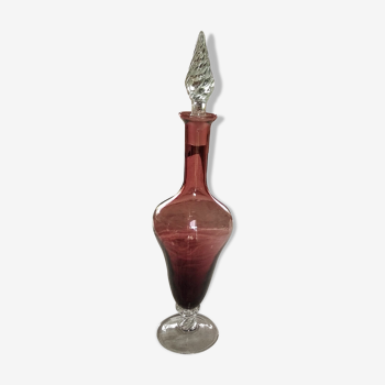 Purple-colored liquor-blown glass decanter with carved foot