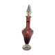 Purple-colored liquor-blown glass decanter with carved foot
