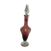 Purple-colored liquor-blown glass decanter with carved foot