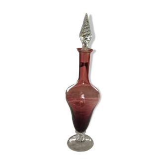 Purple-colored liquor-blown glass decanter with carved foot