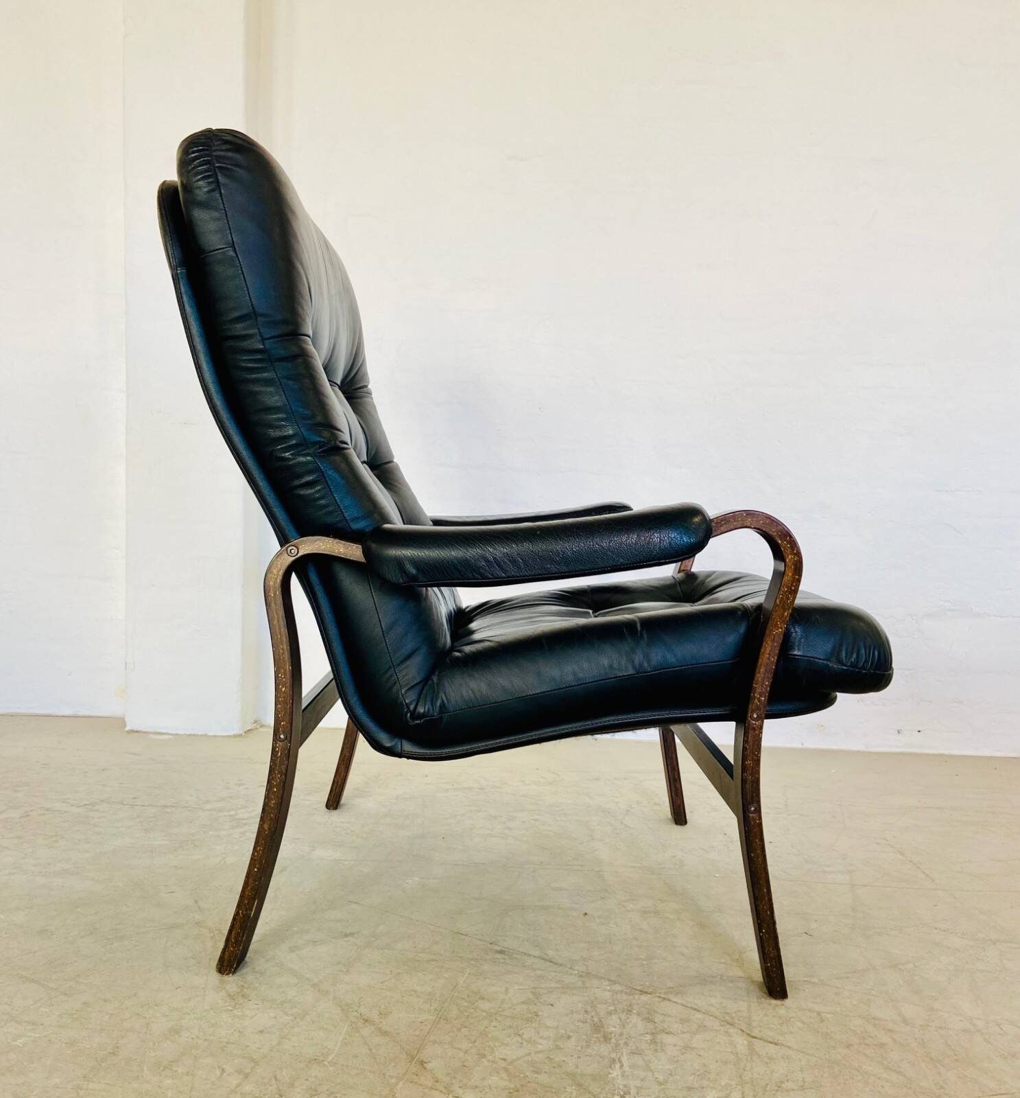 Vintage mid-century Scandinavian black leather lounge chair 1970s