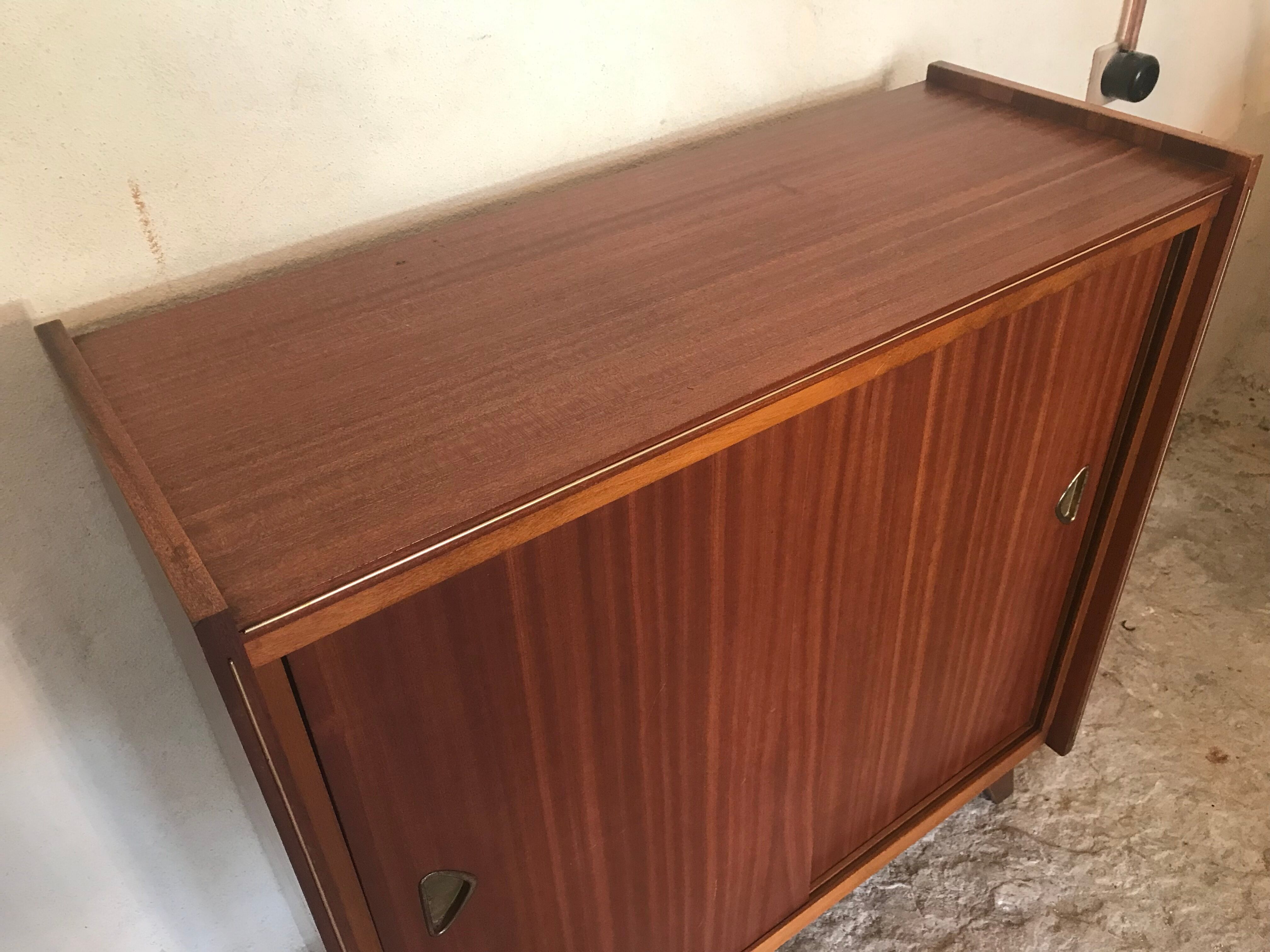 Vintage storage cabinet teak veneer sliding door compass feet