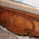 Walnut rocaille bed from the early 20th century.