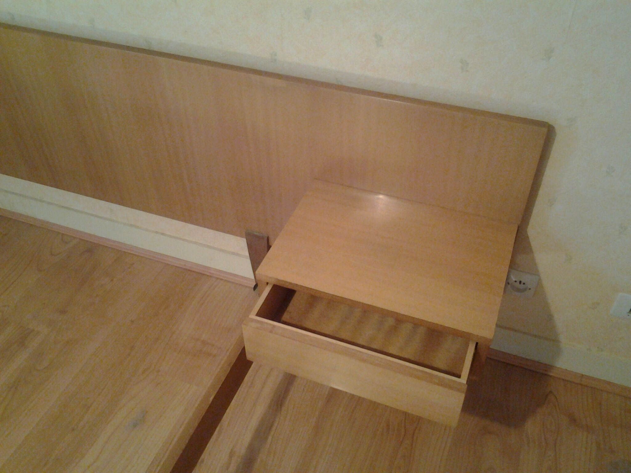 Bed with integrated bedside tables