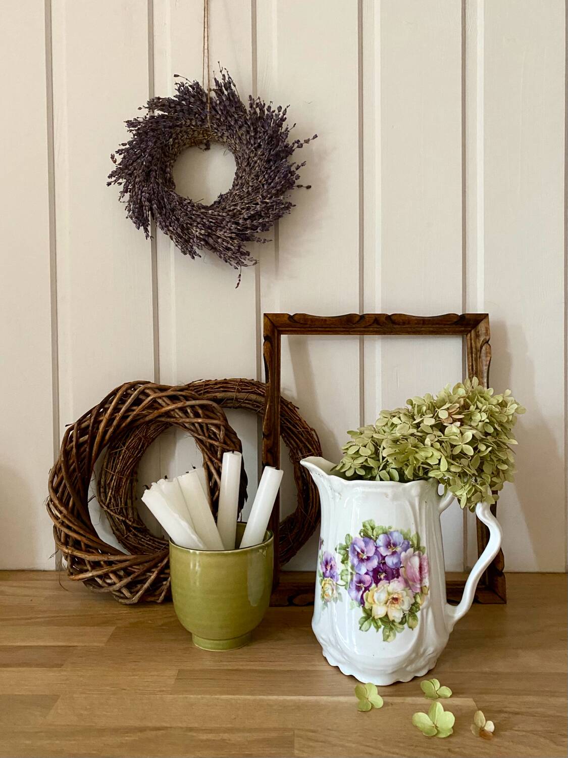 Old ceramic pitcher decorated with flowers