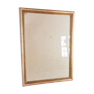 Old frame beaded decoration, gilded stucco wood