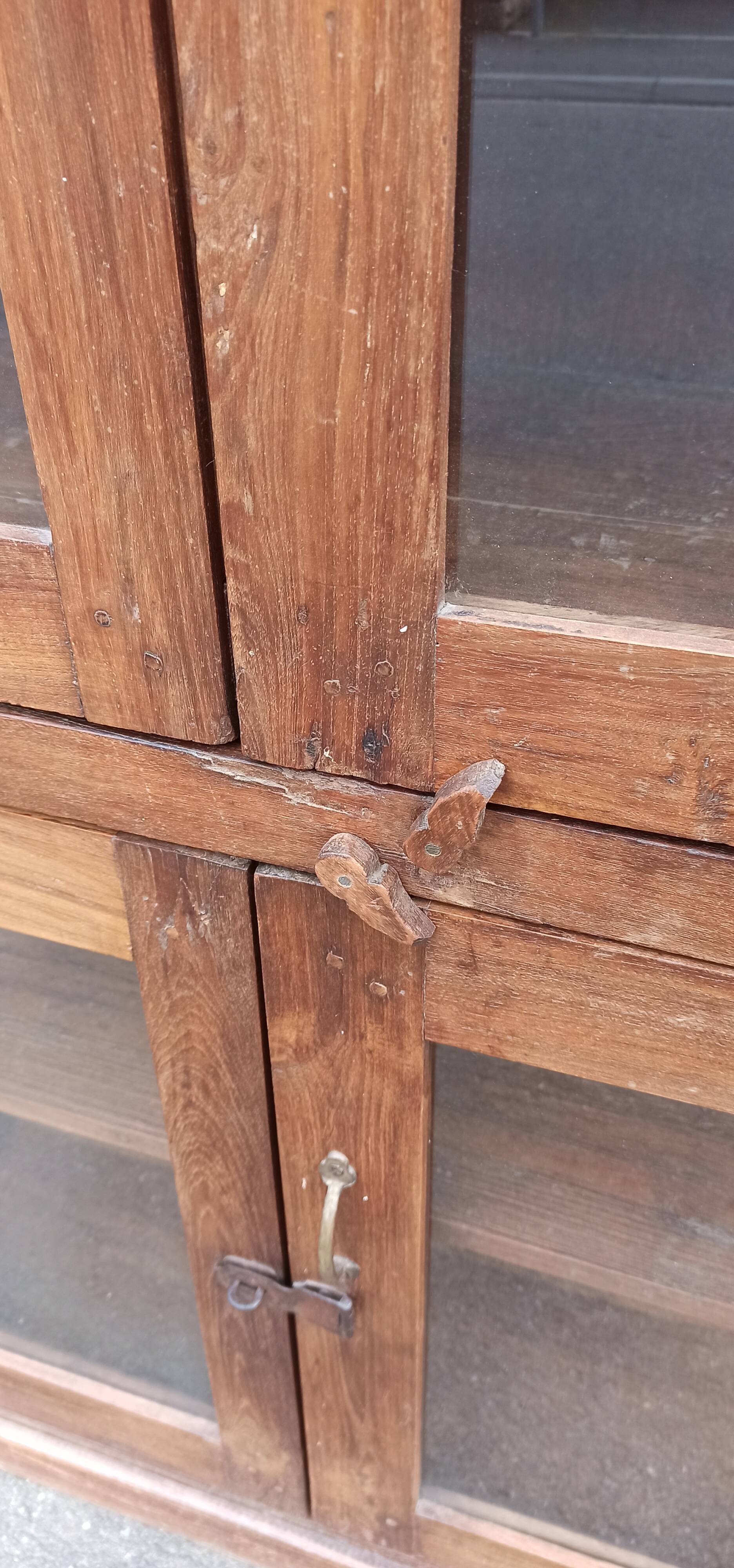 Old wooden display cabinet with three glazed sides