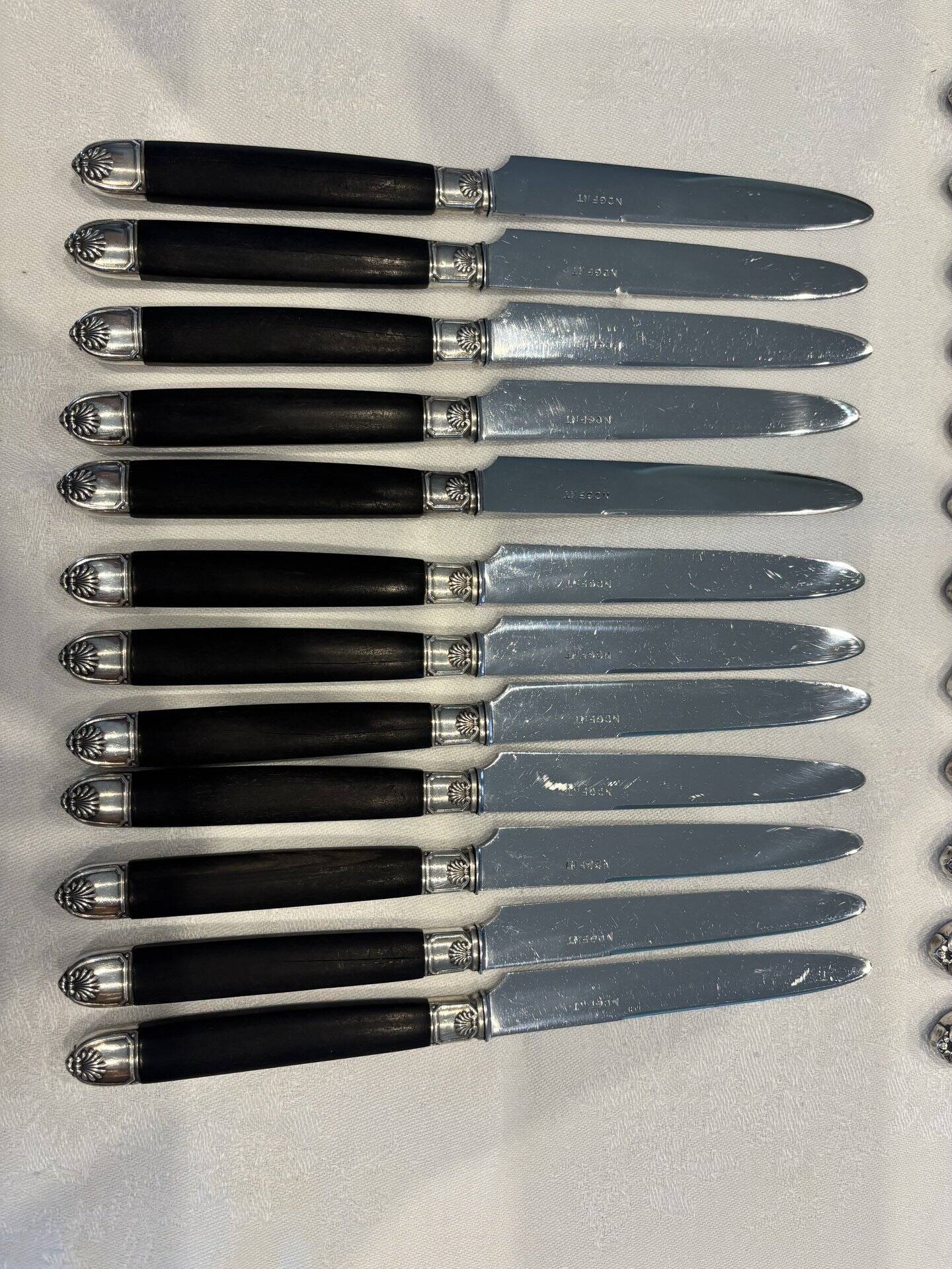 Empire-style knife set in ebony, with silver ferrules and pommels