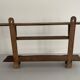 Art Deco wall shelf in wood with three levels, 1940s, Italy.