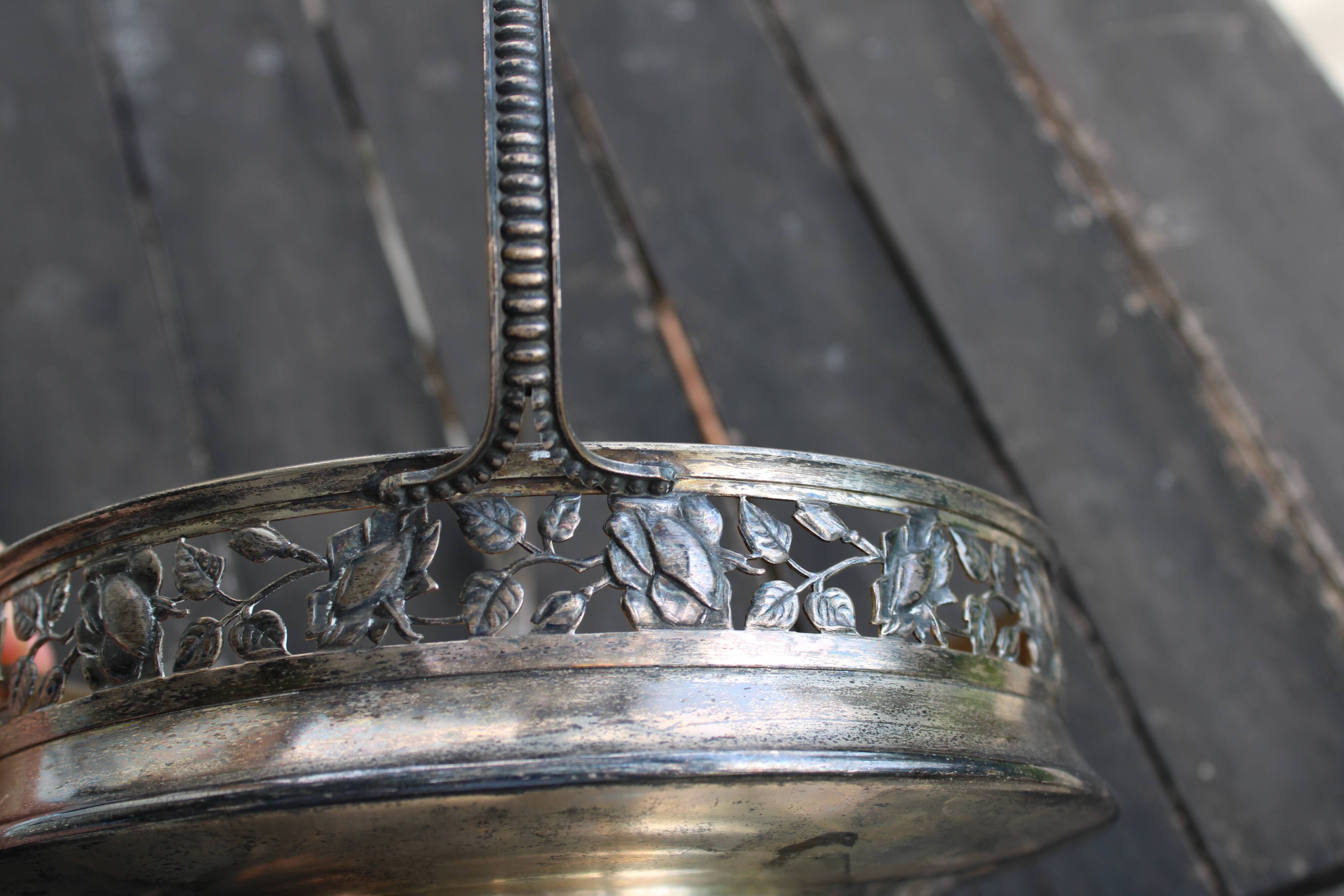 Worked metal fruit basket and glass