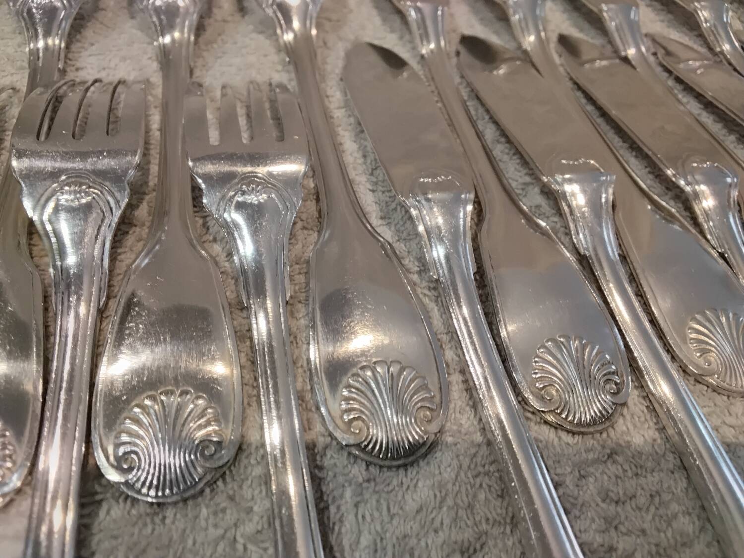 11 silver-plated fish forks and 11 fish knives by Christofle Vendome