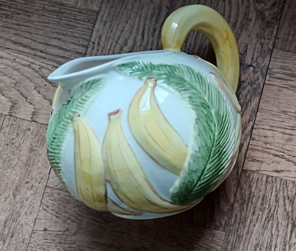 Jug in earthenware with banana decoration.