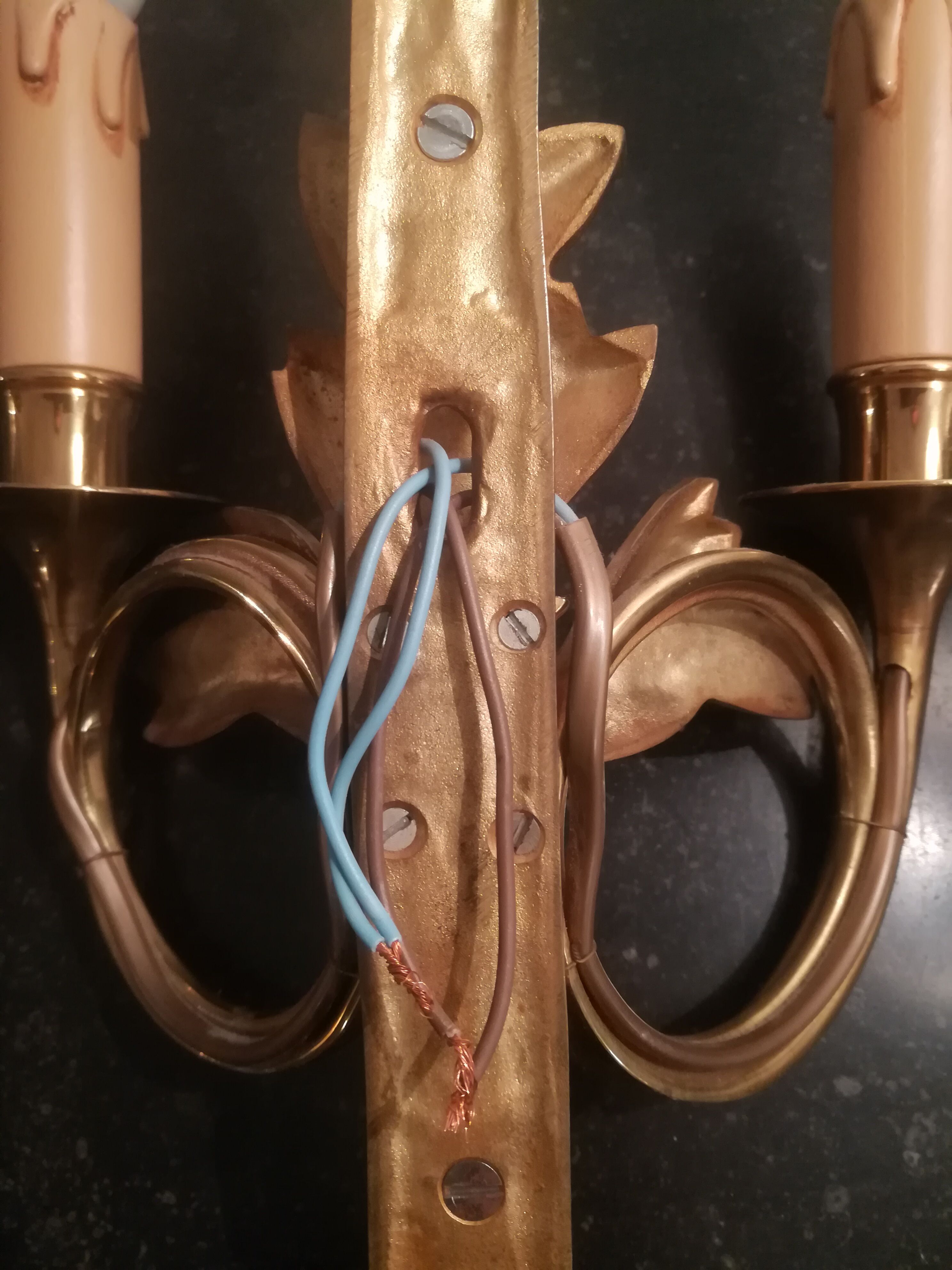 Pair of Louis XVI style sconces in gilded bronze