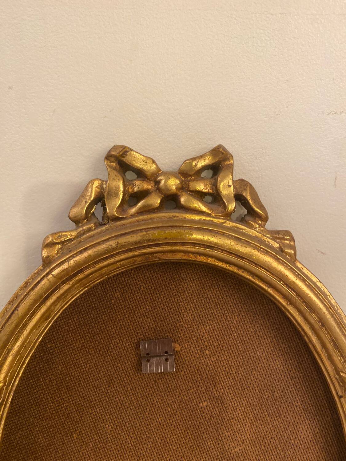 Golden oval wooden frame