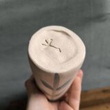 Pichet carafe in unglazed stoneware with a leaf pattern, stamped with the manufacturer's mark.