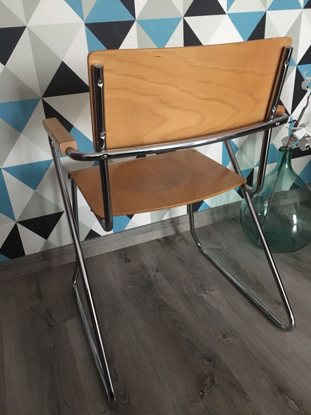 Modernist armchair with armrests