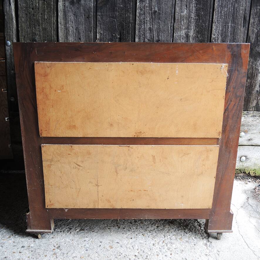 Old wooden chest of drawers with 4 drawers on wheels