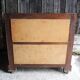 Old wooden chest of drawers with 4 drawers on wheels
