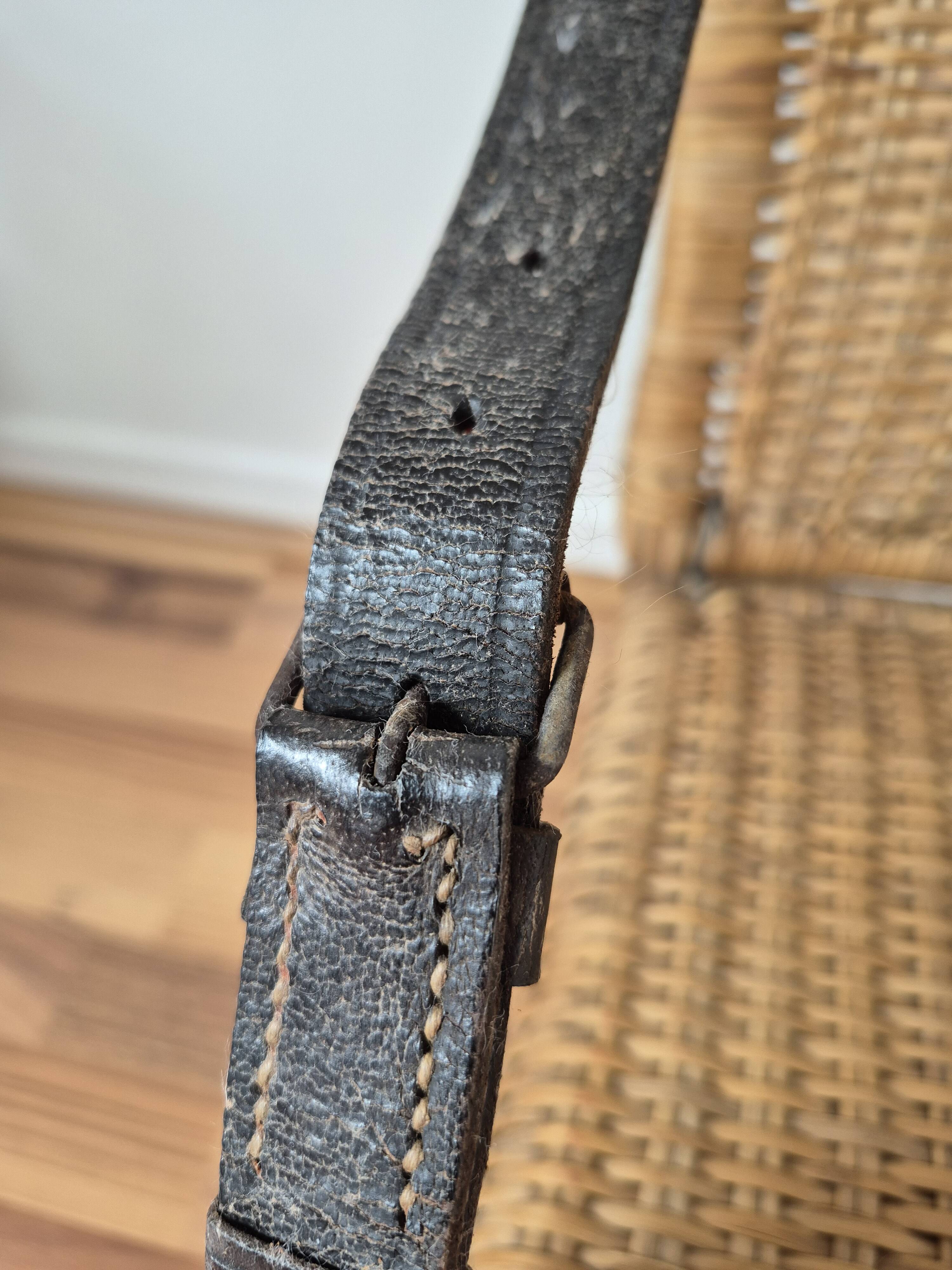 Vintage foldable beach chair, picnic in rattan and leather.