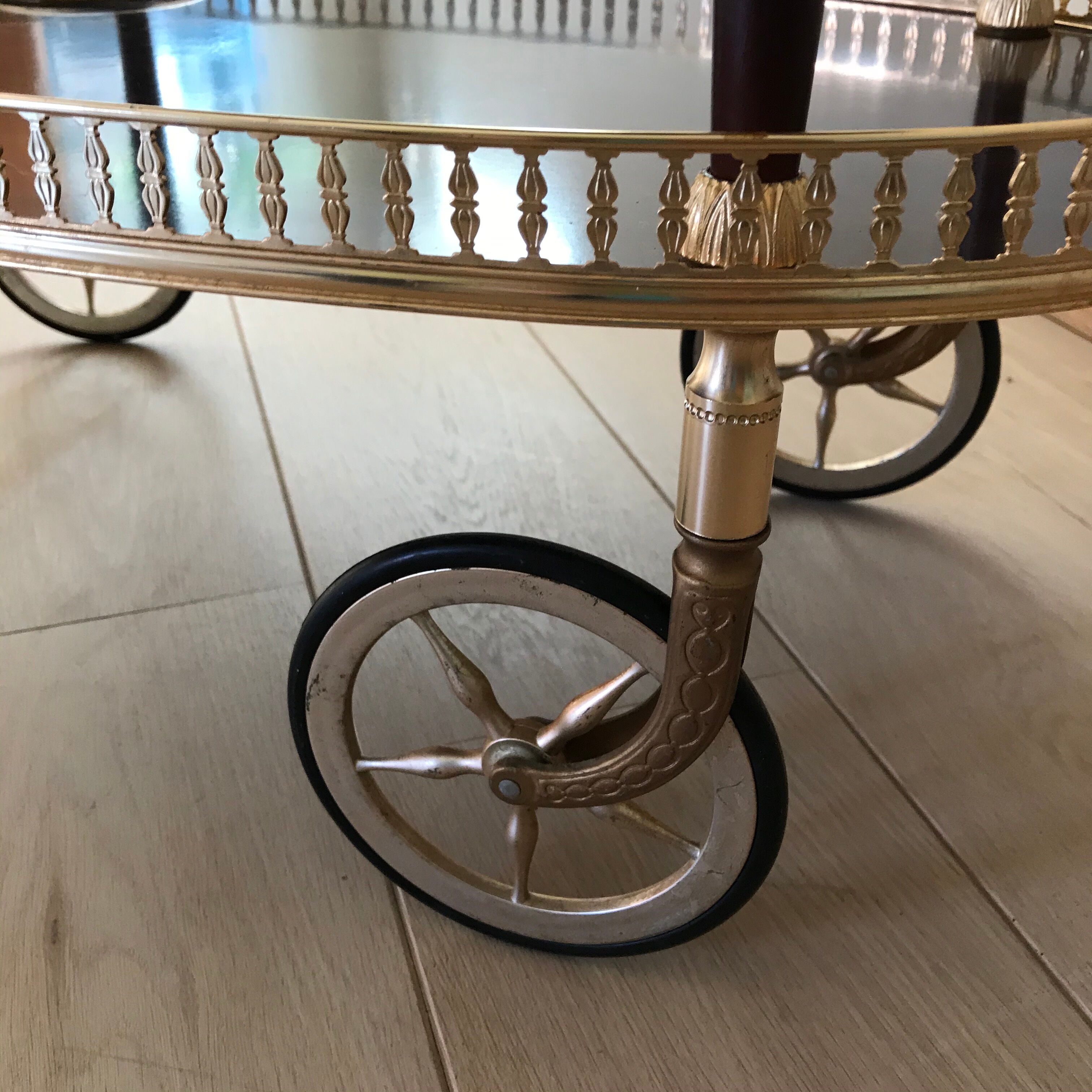 Golden wheeled serving trolley