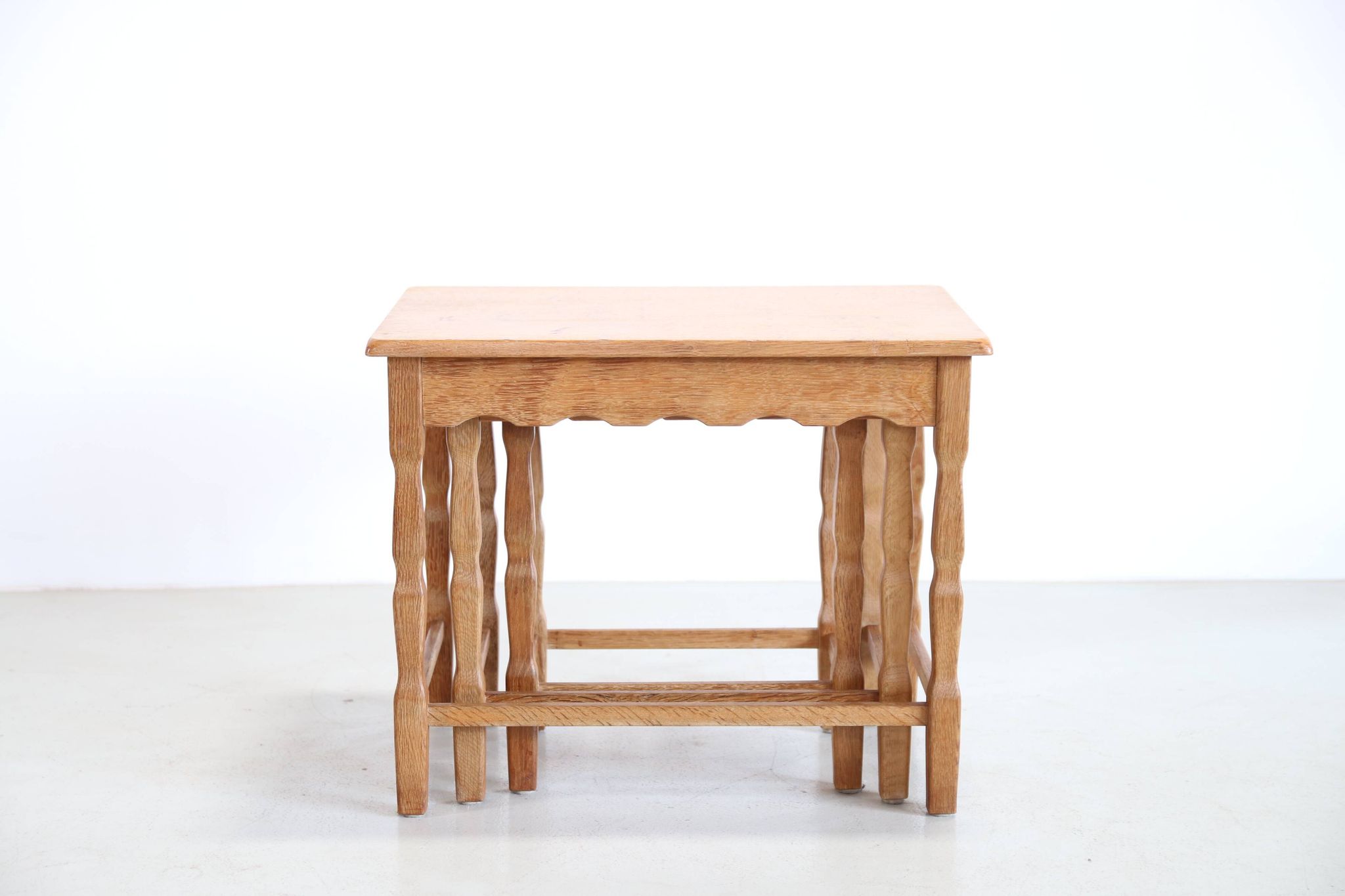 Set of three oak nesting tables attributed to Henning Kjærnulf