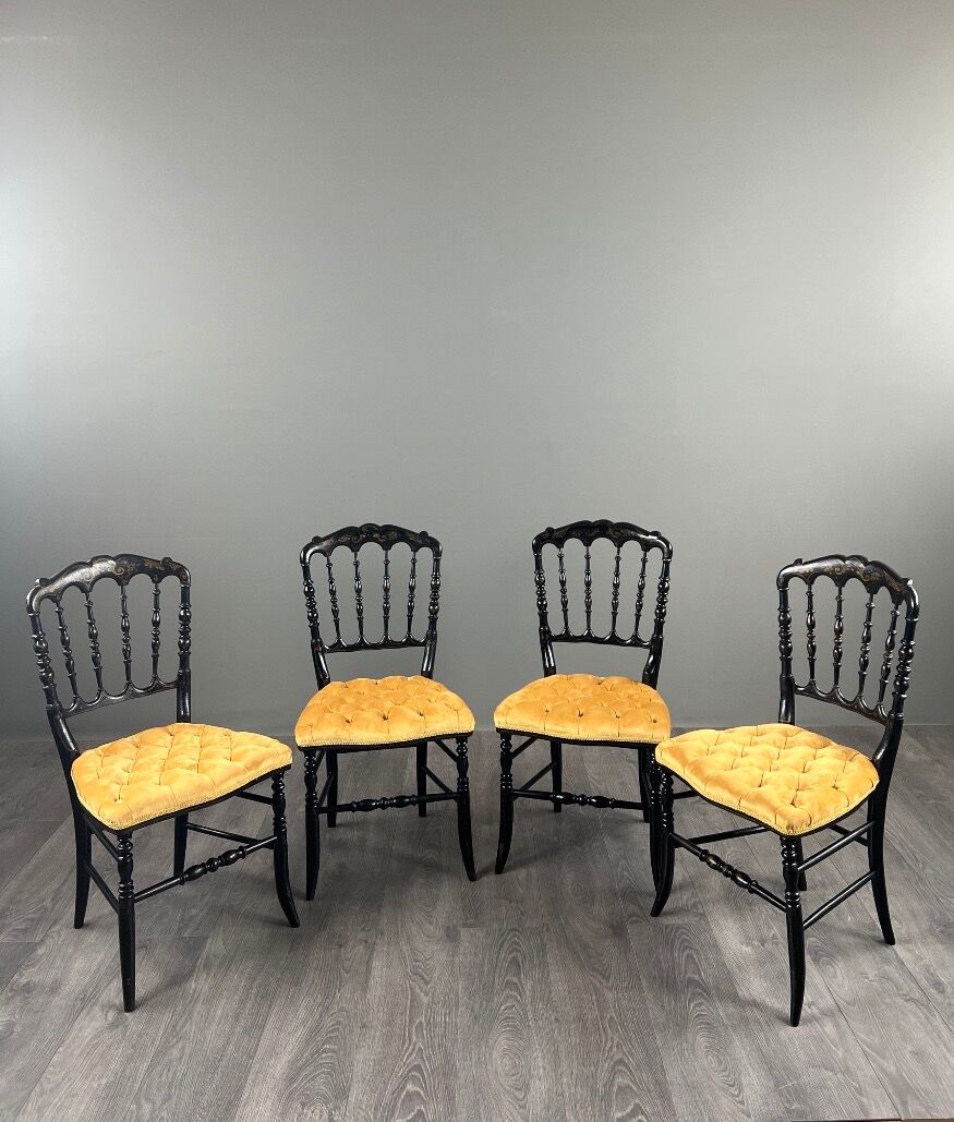 Set of four Napoleon III chairs in blackened wood, 19th century.