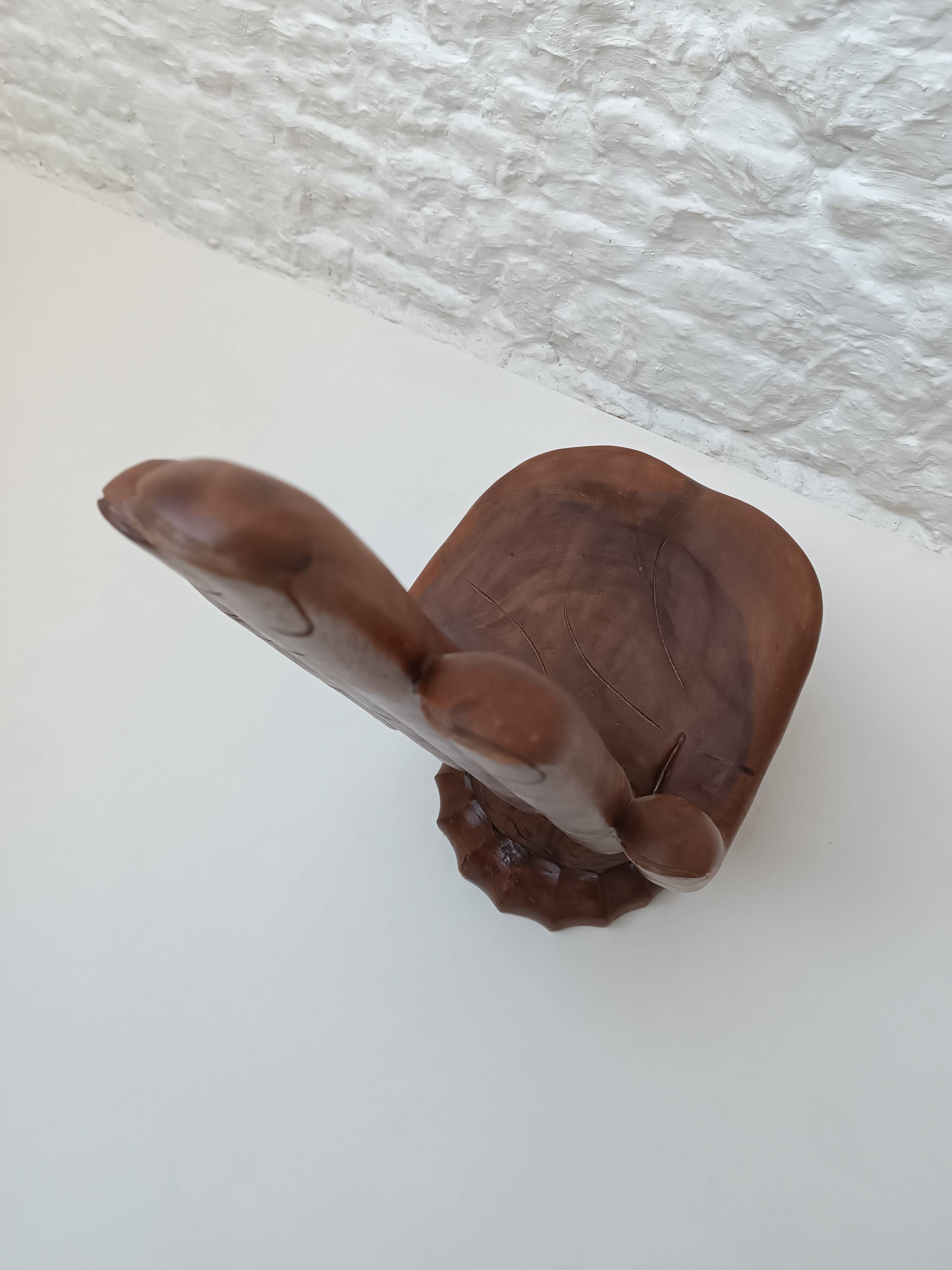 Sculpted wooden chair in the shape of a hand, 1960.