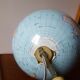 Bright vintage Earth globe brand Vulliermes with metal tripod foot