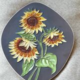 Decorative wall plate with sunflowers.