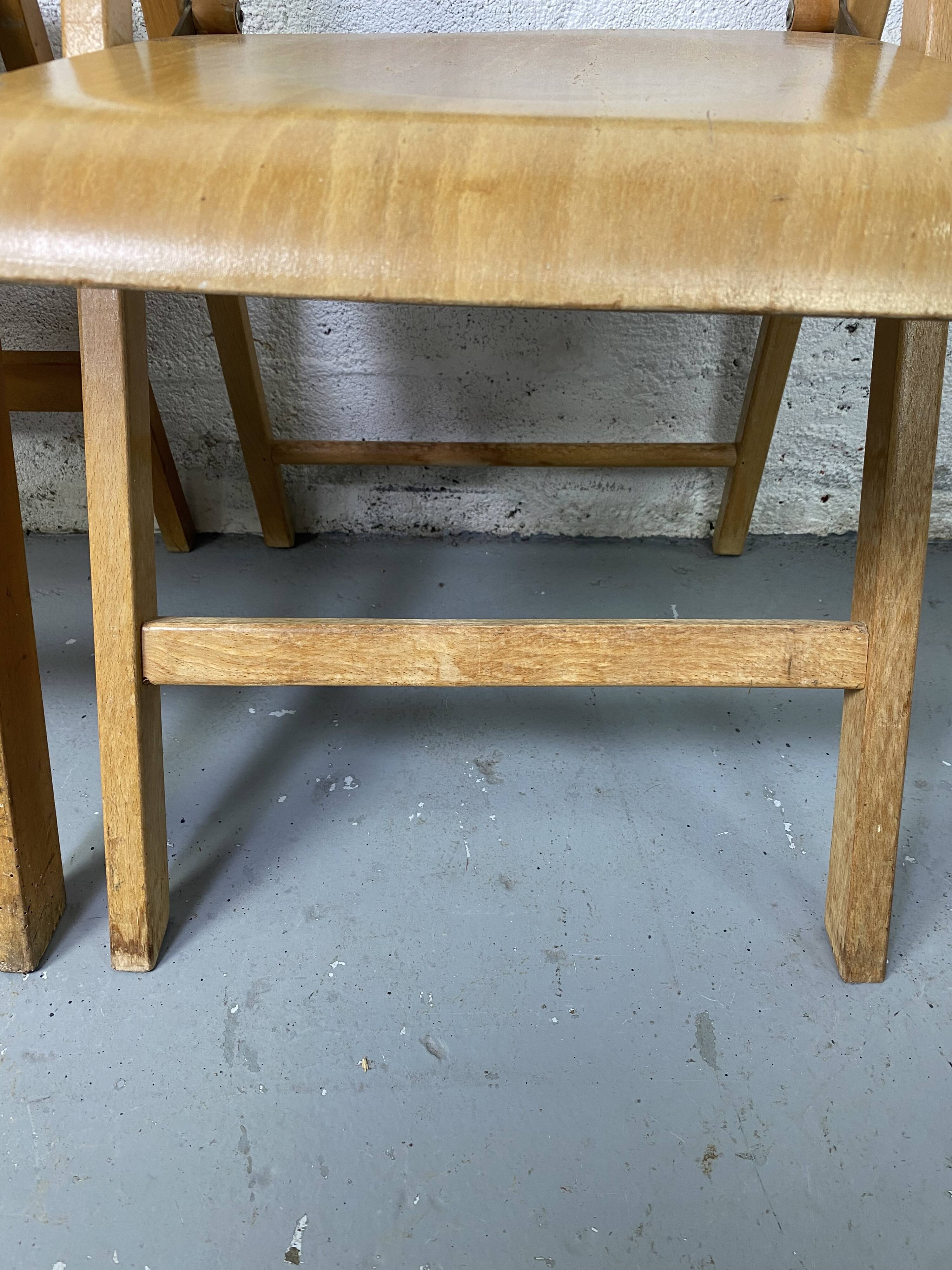 Pair of mismatched wooden folding chairs