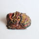 Two polychrome painted and gold leaf gilded Barong dance masks from Bali, Indonesia.