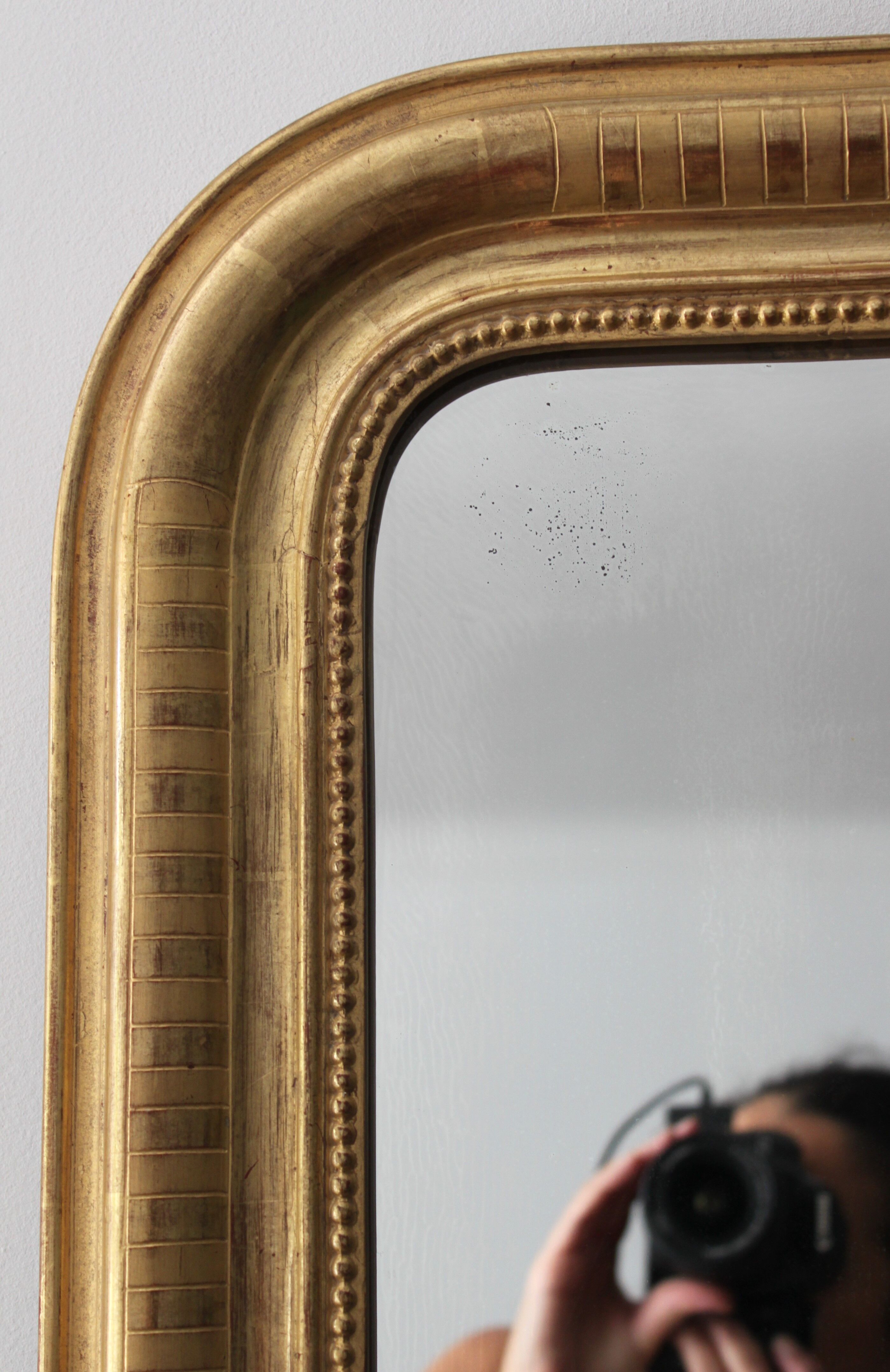 Louis Philippe mirror gilded with gold leaf and original ice dated 1879