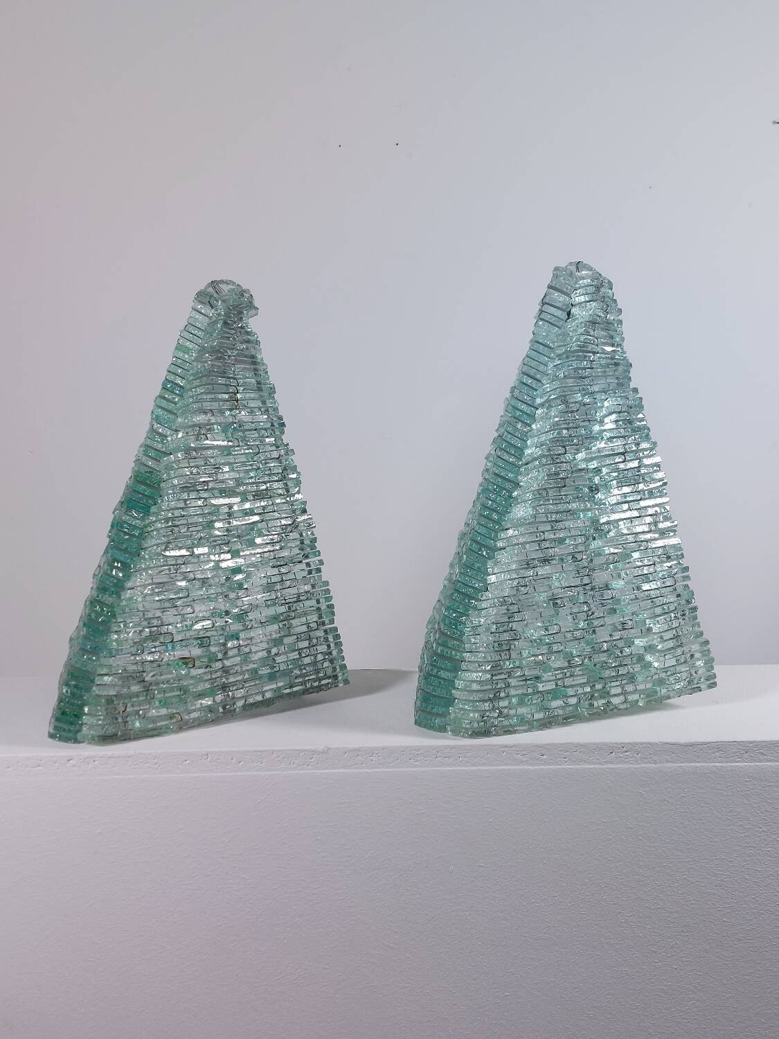 Pair of pyramid-shaped wall sconces in glass in vintage French style.