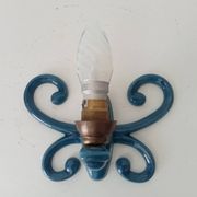 Antique wall light in enamelled cast iron.